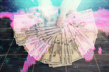 Multi exposure of financial theme drawing hologram and USA dollars bills and man hands. Business concept.