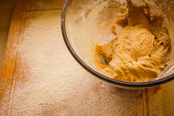 Rye Buckwheat dough rising in a bowl with a flour board dusted and used for baking