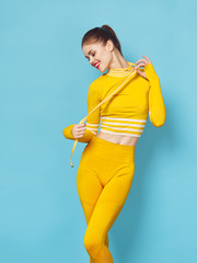 Jolly woman workout sport slim figure measuring tape joy