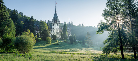 Peles Castle, famous residence of King Charles I in Sinaia, Romania. Peaceful summer landscape at...
