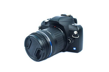 A black colored digital camera with a nice lens attached to it on top of white background