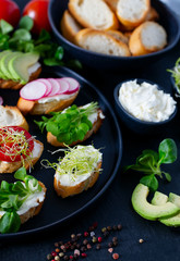 toasted breads of baguette with cream cheese and vegetables