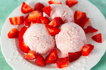 strawberry ice cream on turquoise surface