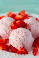 strawberry ice cream on turquoise surface