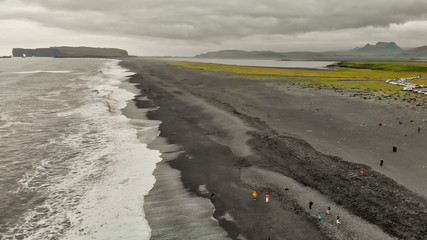 Reynisfjara Black Beach, Southern Iceland in summer season, aerial view