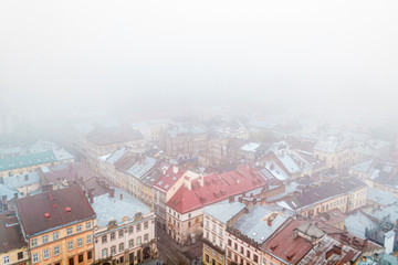 Old city in the fog. City streets in fog aerial view