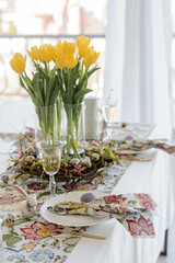 Easter table setting on color wooden background