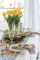 Fototapeta na wymiar Easter table setting on color wooden background
