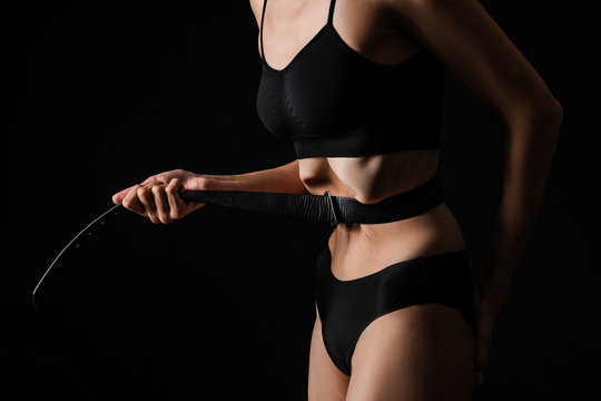 Sick woman tightening her waist with belt on dark background