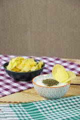 Chips and yogurt mint dip sauce in a bowl