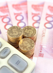 Chinese banknotes,coins and calculator