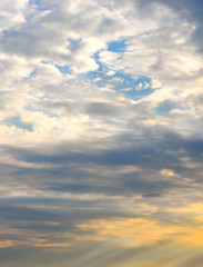 Fototapeta premium Sky at dusk with clouds and the horizon line just tinted yellow from the sun