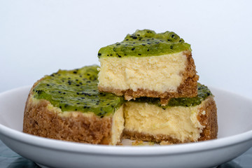 Cheese cake topped with kiwi fruit jam, closeup