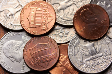 American banknotes and coins representing the world economy based on the US dollar.