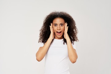 Cheerful woman curly hair smile joy gray background