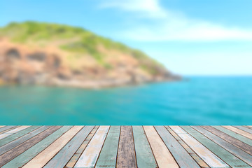 Wood table top with blurred nature scene tropical beach