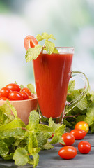 Fresh tomato juice with tomatoes and peppermint leave on table, Healthy food.