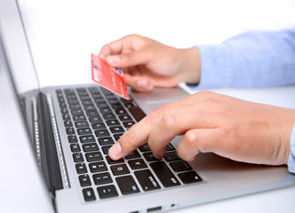 Hands with keyboard and credit card