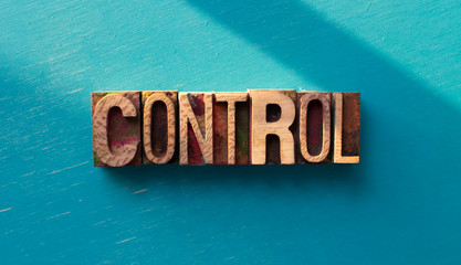 Control word written with wood type blocks