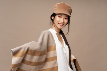 Cheerful woman Asian appearance smile bright makeup luxury beige background