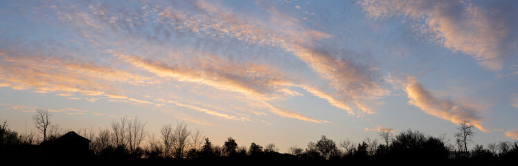 Obraz premium Purple-magenta clouds. Cirrus cloudscape on blue sky.Tragic gloomy sky. Landscape with bloody sunset. Fantastic skies on the planet earth.