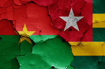 flags of Burkina Faso and Togo painted on cracked wall