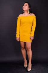 Beautiful overweight Asian woman wearing off shoulder dress
