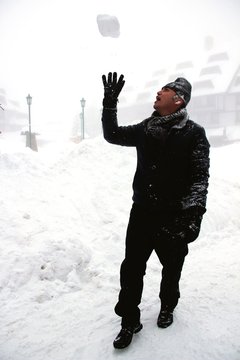 Man Throwing Snowball