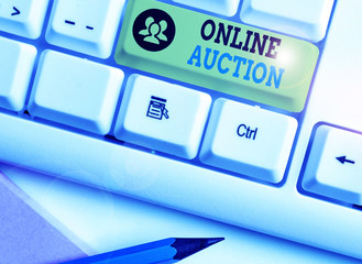Conceptual hand writing showing Online Auction. Concept meaning process of buying and selling goods...