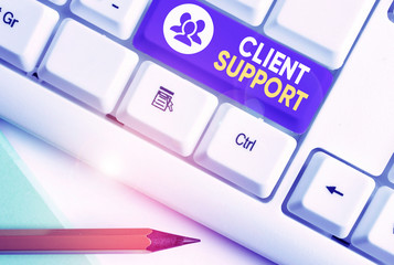 Writing note showing Client Support. Business concept for focus on helping customers to use products and services