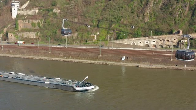Cable car lift to the fortress ehrenbreitstein over the river rhine with a ship in Koblenz near Deusches Eck german corner aerial drone shot 4k 30p
