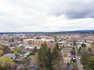 Suburb of the USA, filmed from a height, trees and houses. Background