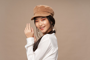 portrait of a young woman wearing a cap
