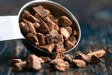 Cinnamon Chips Spilled from a Teaspoon