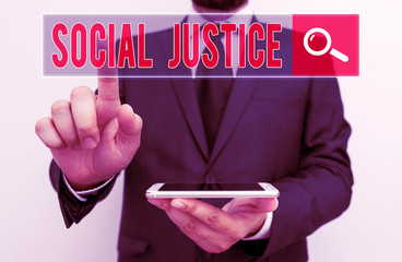 Writing note showing Social Justice. Business concept for Equal access to wealth and privileges within a society