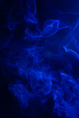 Blue smoke on black background.