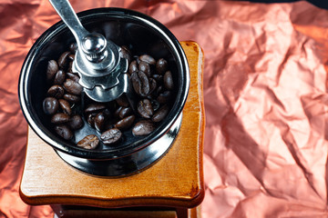 Coffee beans and vintage wooden grinder.