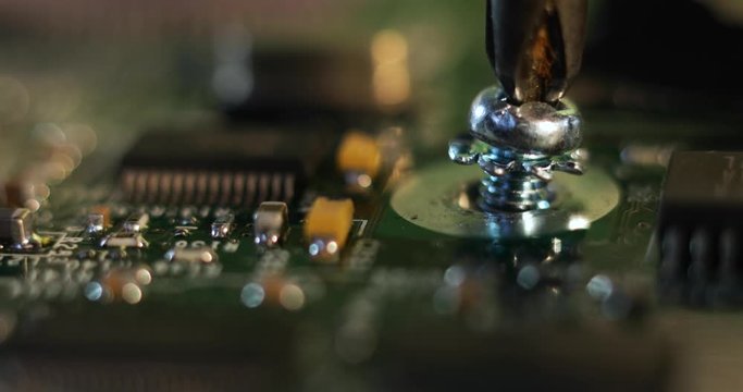 Frustration of trying to put a screw in a motherboard but it won't fit straight.