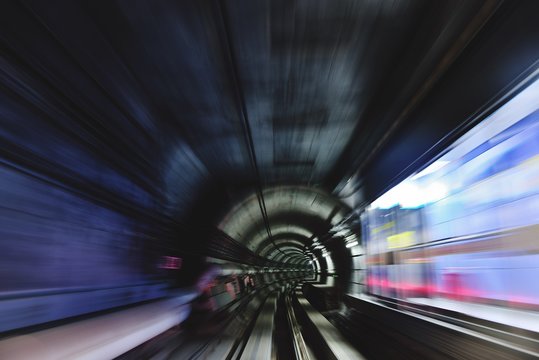 Long Exposure View Of Speeding Train Passing Subway Station