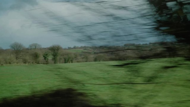 POV From Carhaix to Guingamp Train Going Past Rural Countryside In France. Follow Shot