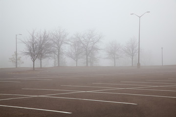 Empty parking lot on a foggy winter day © Jill Greer