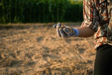Gardeners check soil conditions for farming