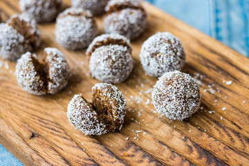 Sweet coconut chocolate truffles energy bonbon balls. Vegan healthy dessert food.