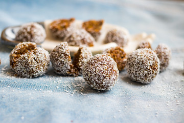Sweet coconut chocolate truffles energy bonbon balls. Vegan healthy dessert food.