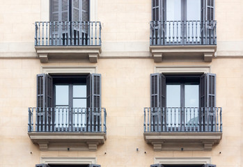 Facade of the house with windows and balconies