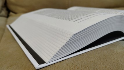 Open book, concept photo at an angle. Reading and learning.