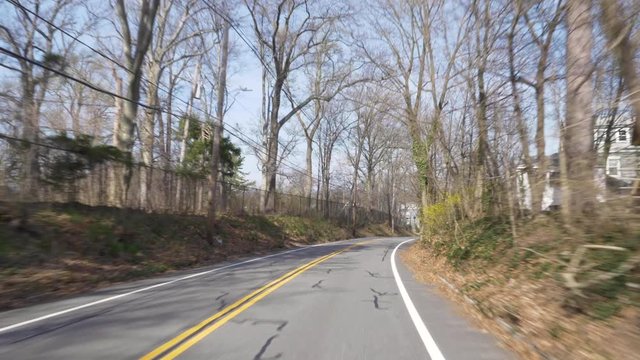 4K: Driving down a city road by a college campus in Morristown New Jersey on a beautiful sunny day