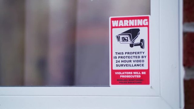 Security sticker on house window