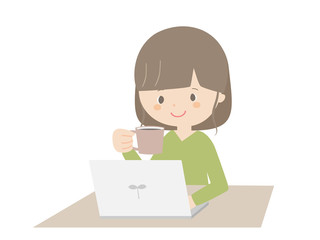 Woman drinking coffee while looking at the computer.