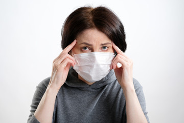 woman with mask. stressed woman with headache